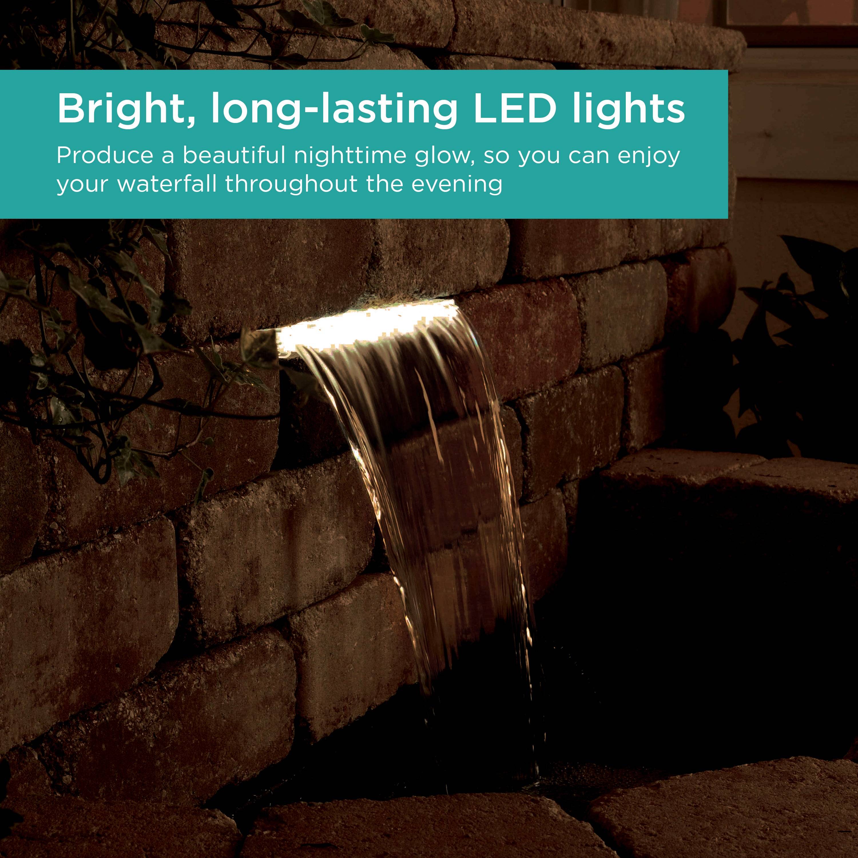 Waterfall Spillway with lights shining at night